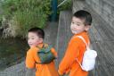 Brothers wearing Go! Jacket as Back Pack
